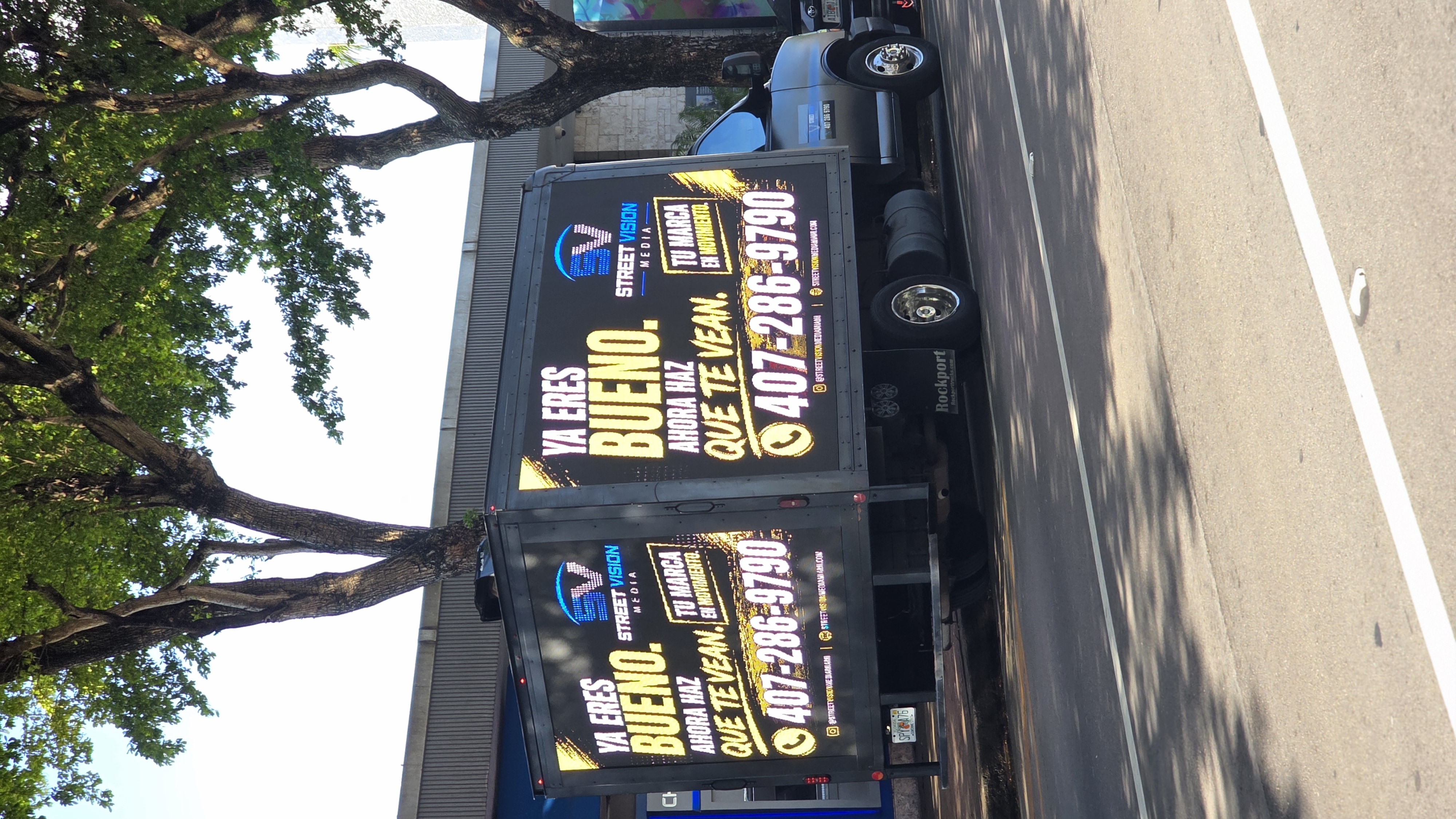 Street Vision Media truck displaying its own advertising and contact number on the LED screens